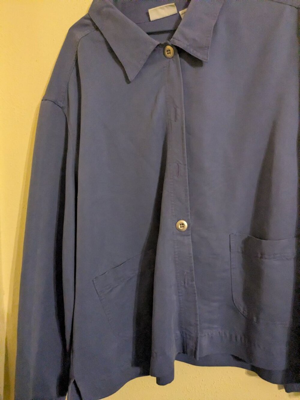 Dark periwinkle blue top or jacket.